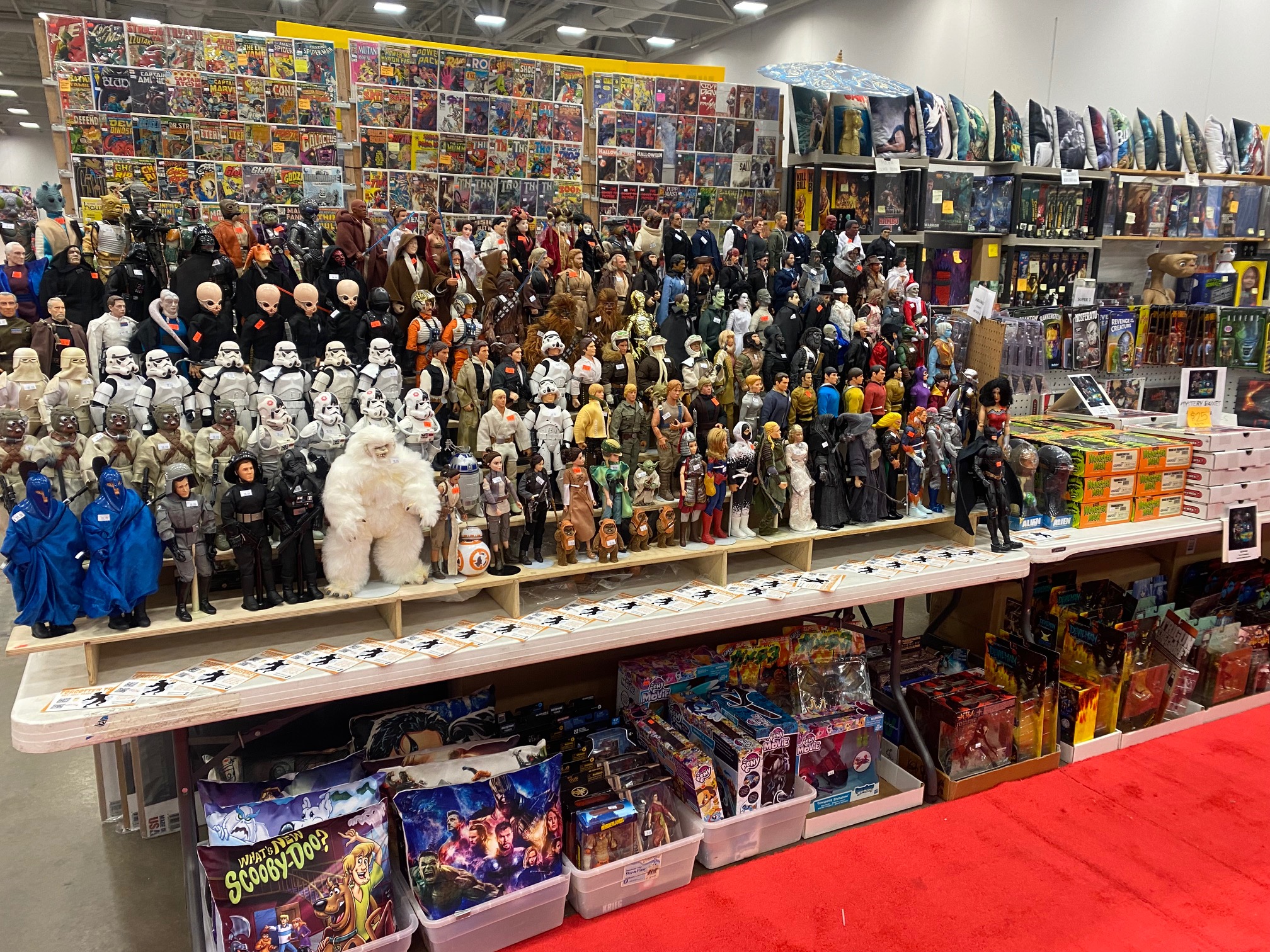 The Forgotten Treasures booth filled with comics, action figures and collectibles at a convention